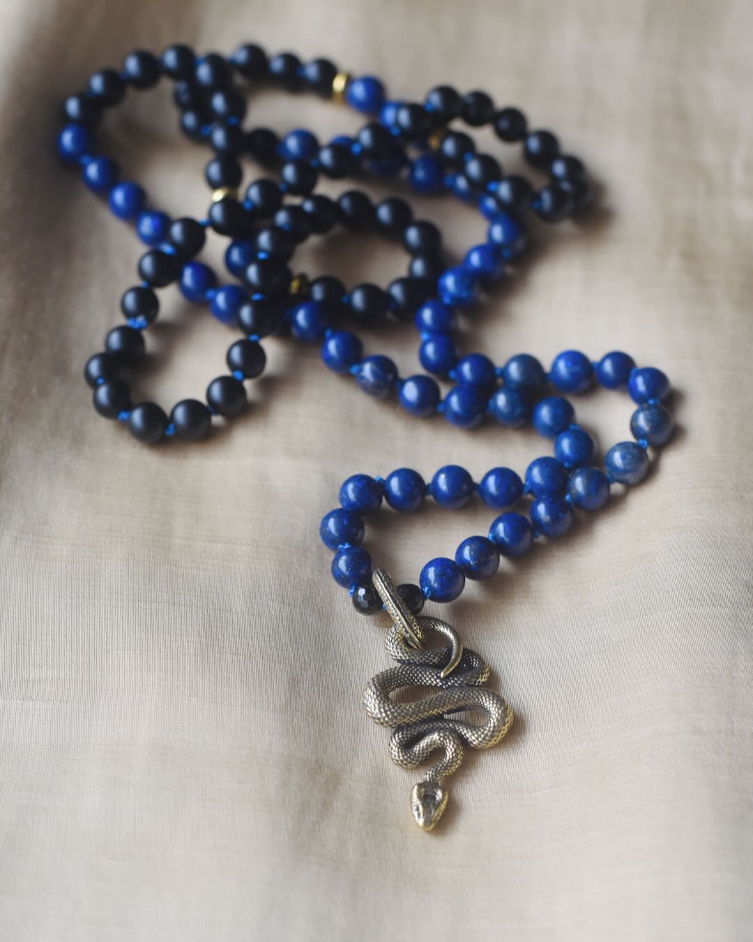 Handmade Gemstone Mala beads necklace with black onyx and blue lapis lazuli and a serpent pendant