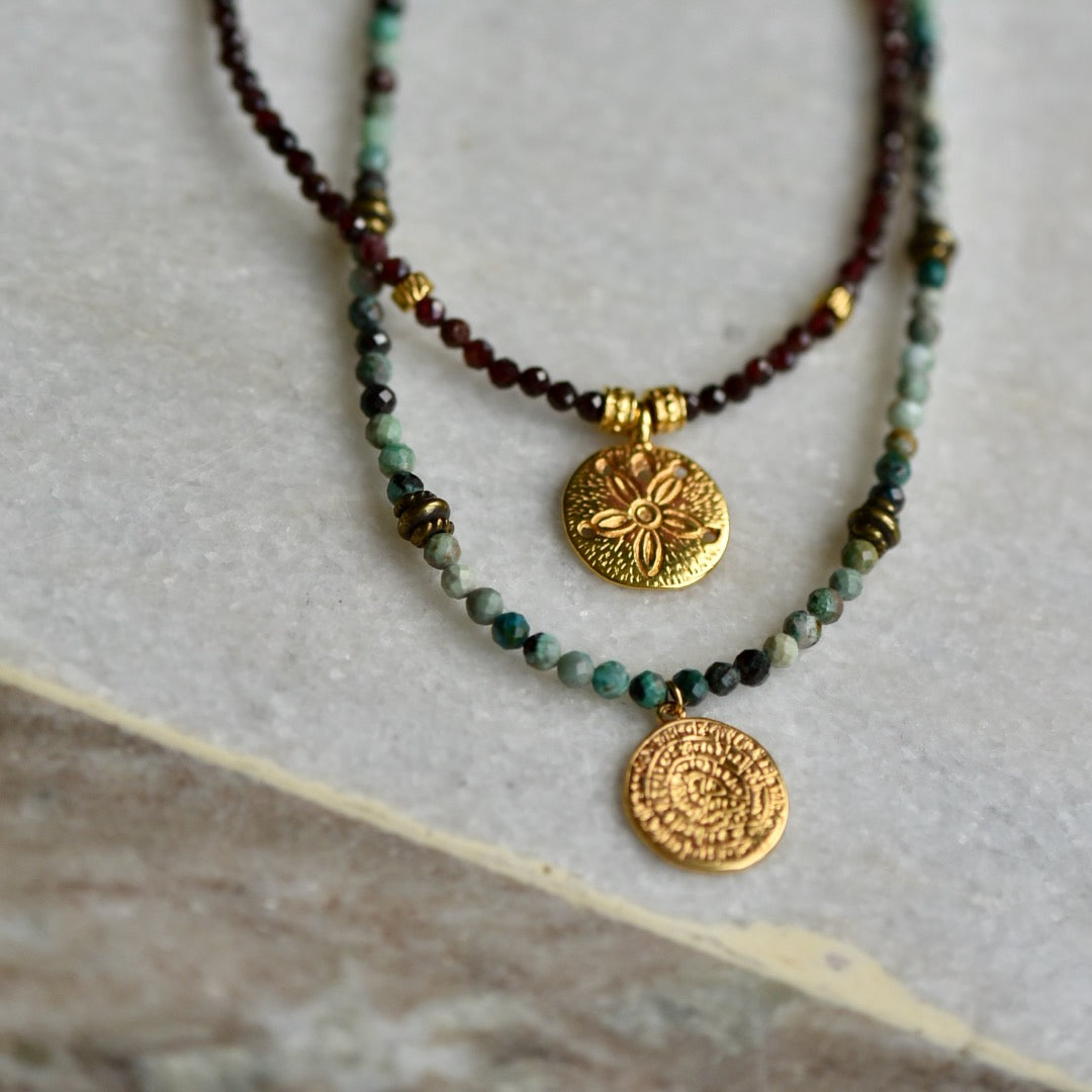 Gemstone necklace with Chrysocolla and golden sun pendant