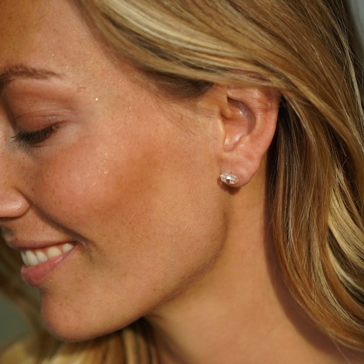 Lady wearing Unity Studs Earrings in Silver and Double-Terminated Clear Quartz Crystal