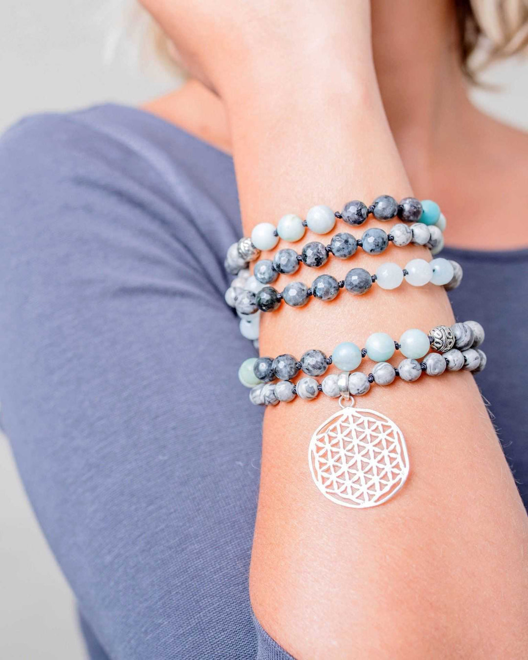 Flower of Life Gemstone Mala on a wrist