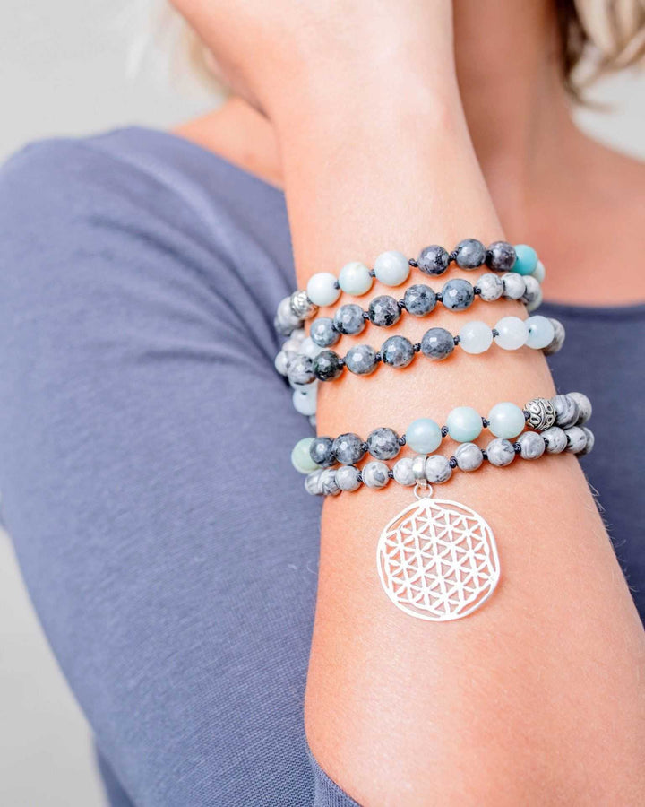 Flower of Life Gemstone Mala on a wrist
