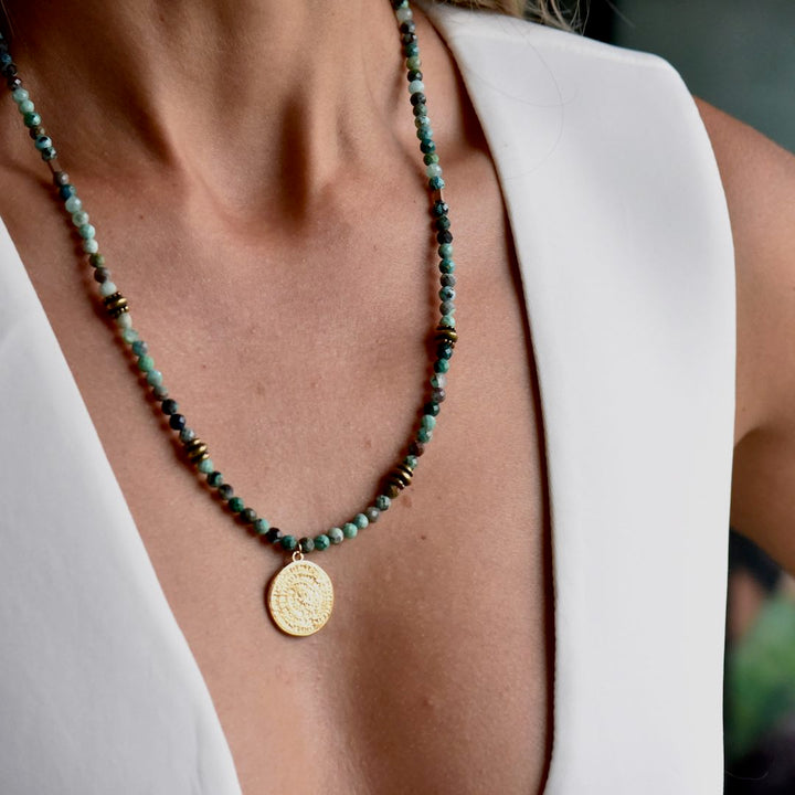 Lady wearing Natural Healer Gemstone necklace with Chrysocolla and golden sun pendant Manipura handmade
