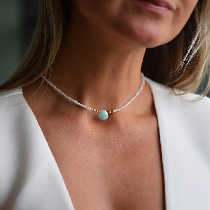 Lady wearing Natural Radiance choker necklace with Moonstone and Amazonite pendant by Manipura