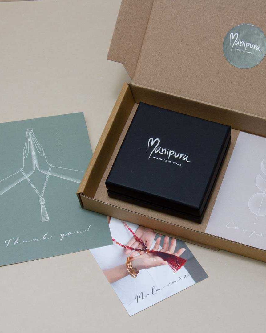 Manipura mala shop packaging 