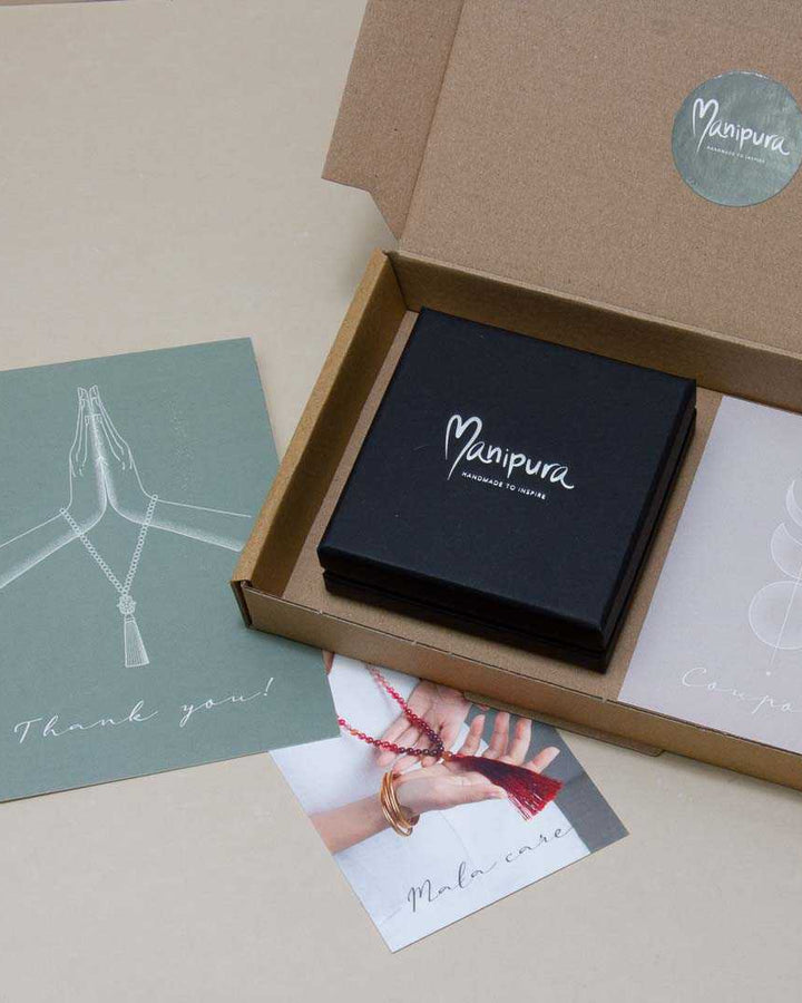Manipura mala shop packaging 