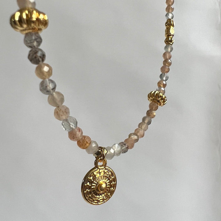 Moonstone beaded gemstones necklace with a golden shield pendant by Manipura Mala