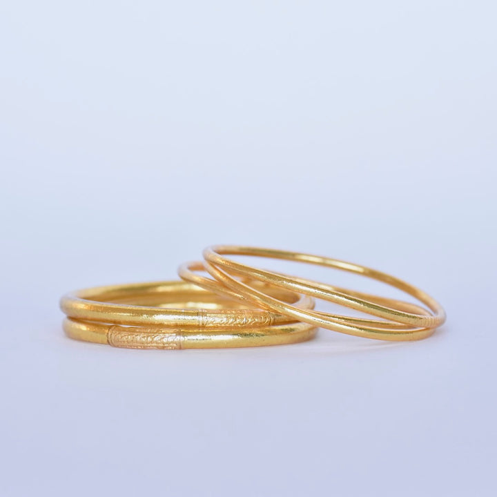 Set of thin and classic gold leaf temple bangles with mantra by M manipura