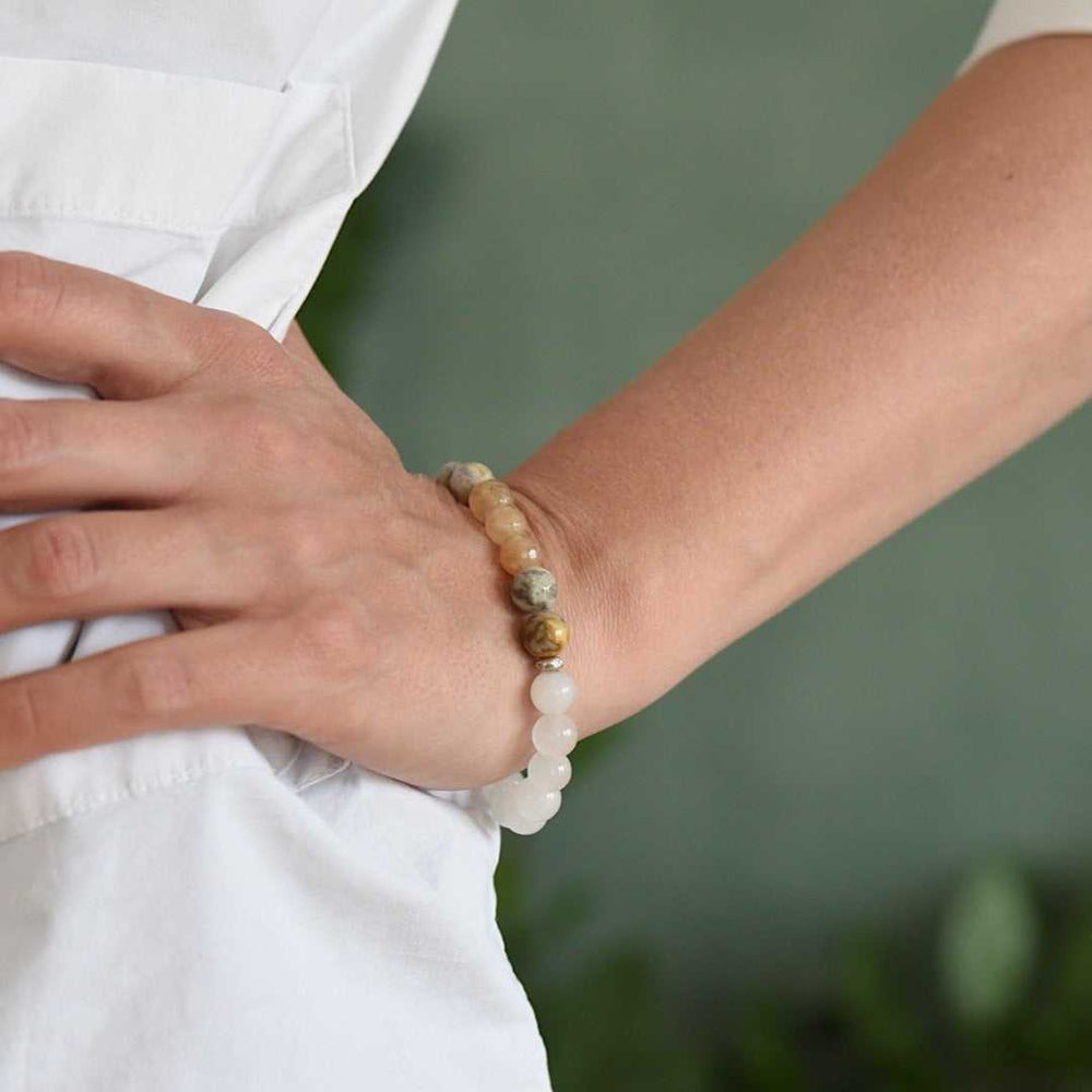 Lady wearing a Jasper Citrine and White Jade Gemstone beaded Bracelet handmade by Manipura